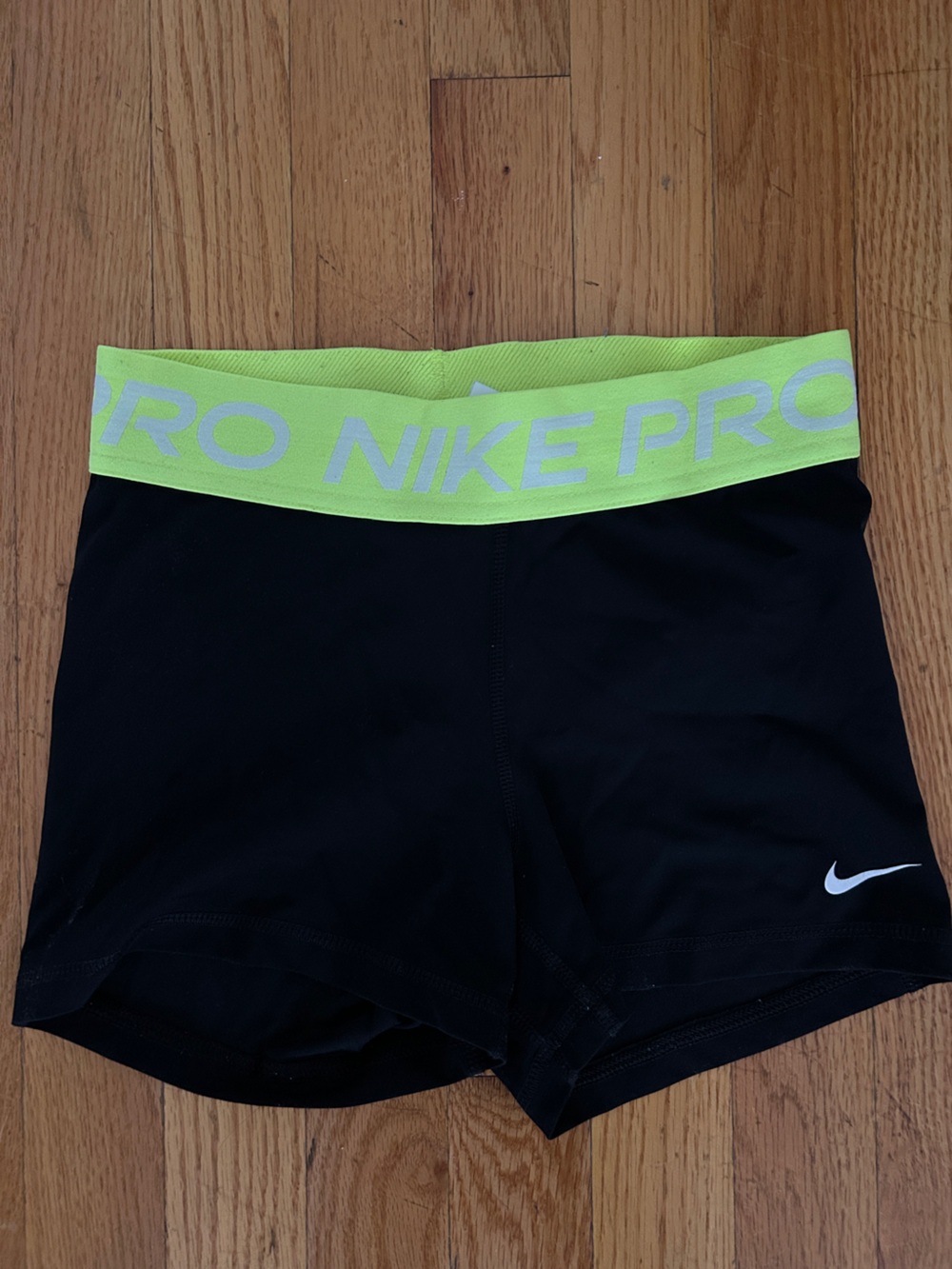 Nike Pro black shorts with neon green waistband